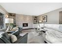 2407 Juniper Road Nw, Calgary, AB  - Indoor Photo Showing Living Room With Fireplace 