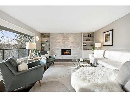 2407 Juniper Road Nw, Calgary, AB - Indoor Photo Showing Living Room With Fireplace