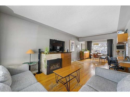 2704 19 Street Nw, Calgary, AB - Indoor Photo Showing Living Room With Fireplace