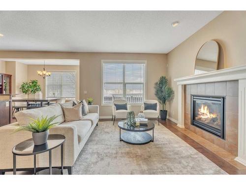 110 Autumn Circle Se, Calgary, AB - Indoor Photo Showing Living Room With Fireplace