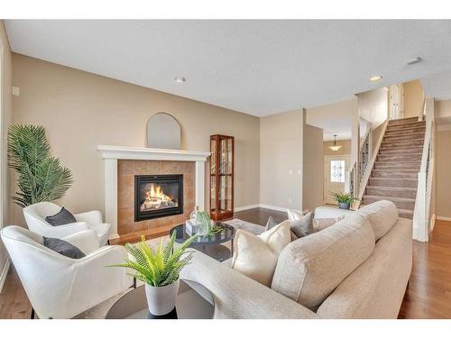 110 Autumn Circle Se, Calgary, AB - Indoor Photo Showing Living Room With Fireplace