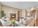 110 Autumn Circle Se, Calgary, AB  - Indoor Photo Showing Living Room With Fireplace 