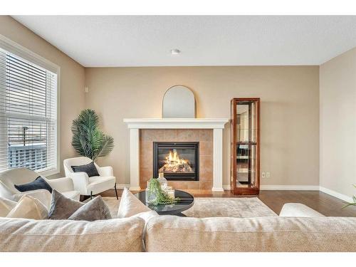 110 Autumn Circle Se, Calgary, AB - Indoor Photo Showing Living Room With Fireplace