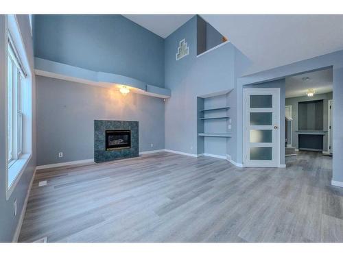 84 Douglas Glen Crescent Se, Calgary, AB - Indoor Photo Showing Living Room With Fireplace