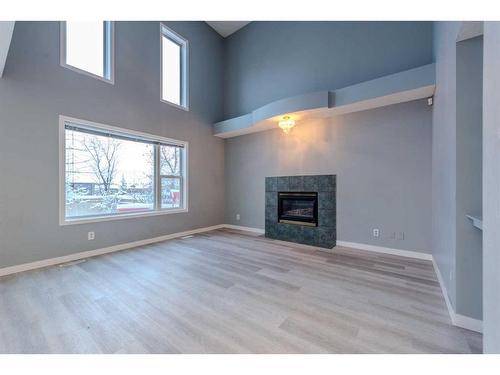 84 Douglas Glen Crescent Se, Calgary, AB - Indoor Photo Showing Living Room With Fireplace