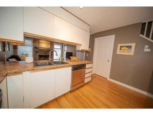 251 Coachway Road Sw, Calgary, AB - Indoor Photo Showing Kitchen With Double Sink