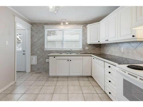 248 Allan Crescent Se, Calgary, AB - Indoor Photo Showing Kitchen With Double Sink