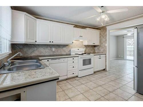 248 Allan Crescent Se, Calgary, AB - Indoor Photo Showing Kitchen With Double Sink