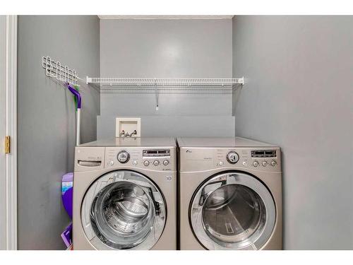 32 Hidden Creek Park Nw, Calgary, AB - Indoor Photo Showing Laundry Room