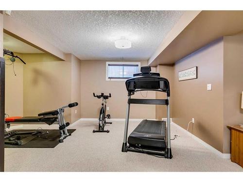 32 Hidden Creek Park Nw, Calgary, AB - Indoor Photo Showing Gym Room