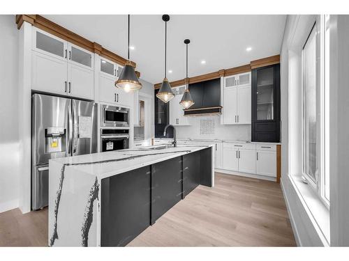 327 Kinniburgh Place, Chestermere, AB - Indoor Photo Showing Kitchen With Upgraded Kitchen