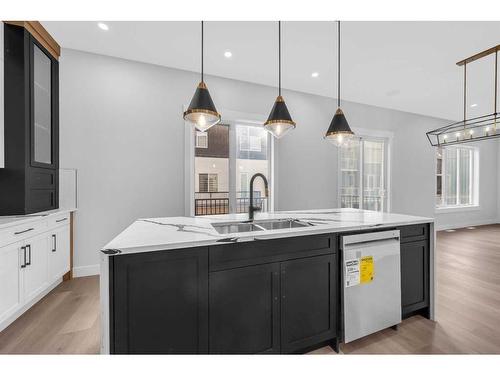 327 Kinniburgh Place, Chestermere, AB - Indoor Photo Showing Kitchen With Double Sink