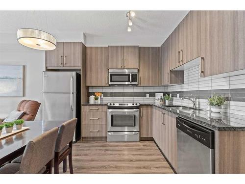 121-4 Sage Hill Terrace Nw, Calgary, AB - Indoor Photo Showing Kitchen With Upgraded Kitchen