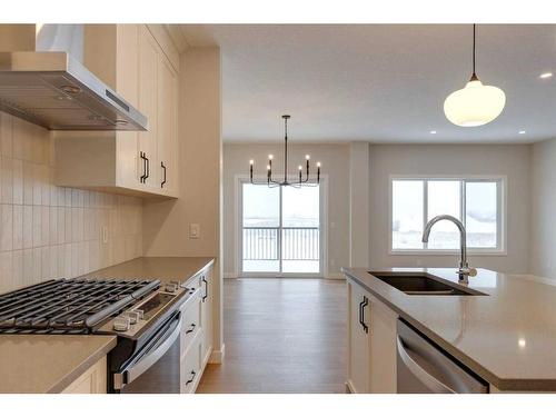 46 Fireside Point, Cochrane, AB - Indoor Photo Showing Kitchen With Upgraded Kitchen