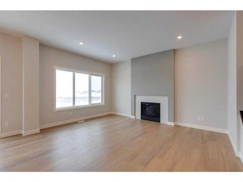 46 Fireside Point, Cochrane, AB - Indoor Photo Showing Living Room With Fireplace