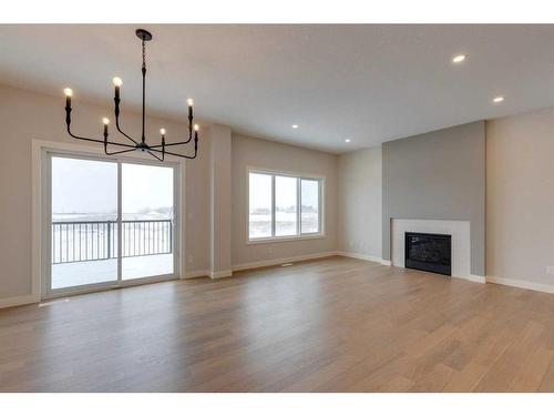 46 Fireside Point, Cochrane, AB - Indoor Photo Showing Living Room With Fireplace