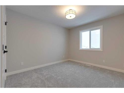 46 Fireside Point, Cochrane, AB - Indoor Photo Showing Other Room