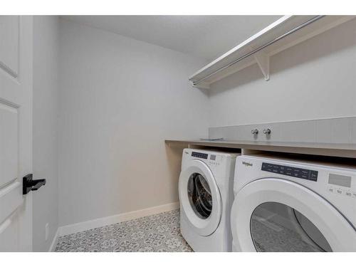 46 Fireside Point, Cochrane, AB - Indoor Photo Showing Laundry Room