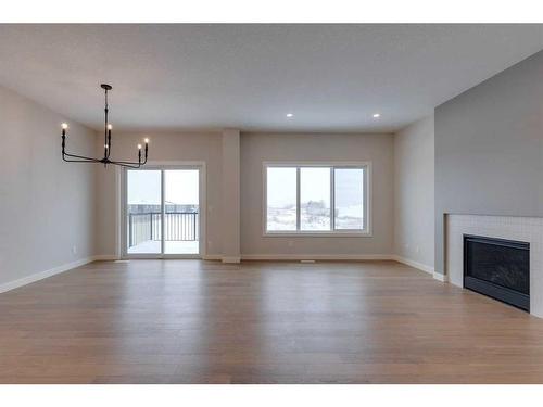 46 Fireside Point, Cochrane, AB - Indoor Photo Showing Living Room With Fireplace