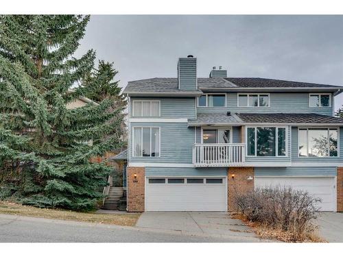 7 Stradwick Place Sw, Calgary, AB - Outdoor With Balcony With Facade