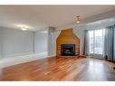 7 Stradwick Place Sw, Calgary, AB  - Indoor Photo Showing Living Room With Fireplace 