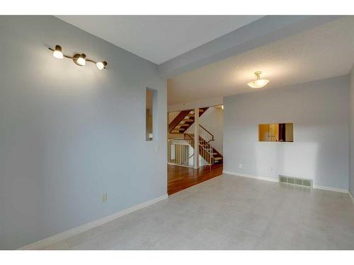 7 Stradwick Place Sw, Calgary, AB - Indoor Photo Showing Other Room