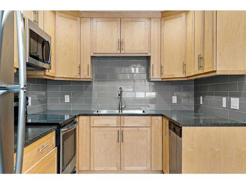 17 Deer Lane Road Se, Calgary, AB - Indoor Photo Showing Kitchen With Stainless Steel Kitchen With Double Sink