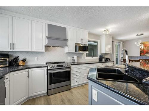 131 Shawcliffe Circle Sw, Calgary, AB - Indoor Photo Showing Kitchen With Stainless Steel Kitchen With Double Sink With Upgraded Kitchen