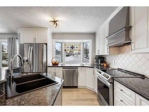 131 Shawcliffe Circle Sw, Calgary, AB - Indoor Photo Showing Kitchen With Stainless Steel Kitchen With Double Sink With Upgraded Kitchen