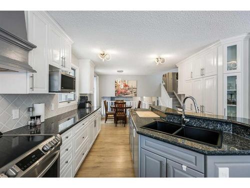 131 Shawcliffe Circle Sw, Calgary, AB - Indoor Photo Showing Kitchen With Double Sink With Upgraded Kitchen