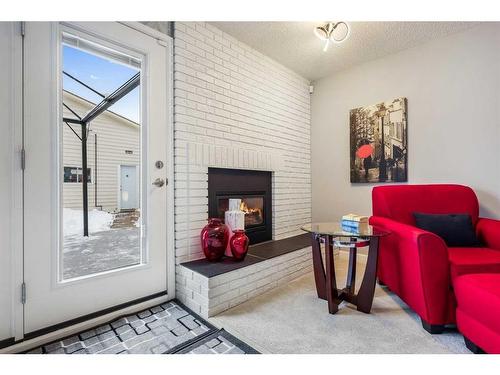 131 Shawcliffe Circle Sw, Calgary, AB - Indoor With Fireplace