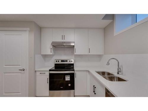 192 Hotchkiss Drive Se, Calgary, AB - Indoor Photo Showing Kitchen With Double Sink