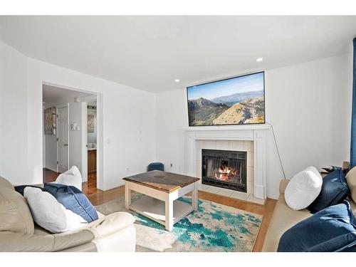 173 Coral Sands Place Ne, Calgary, AB - Indoor Photo Showing Living Room With Fireplace