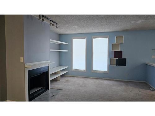 1637 Bowness Road Nw, Calgary, AB - Indoor With Fireplace