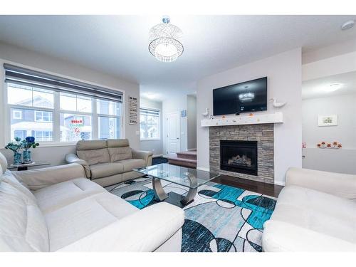 17 Red Embers Row Ne, Calgary, AB - Indoor Photo Showing Living Room With Fireplace