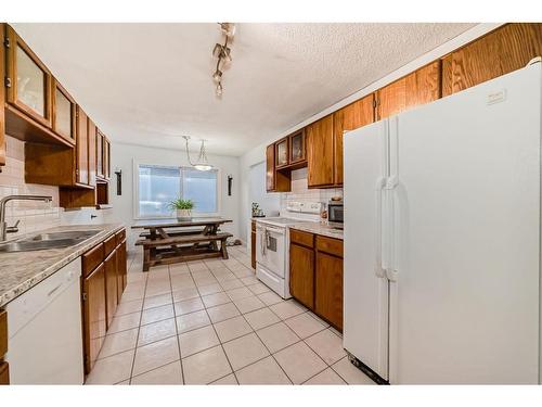 252 And 254 Midridge Place Se, Calgary, AB - Indoor Photo Showing Kitchen With Double Sink