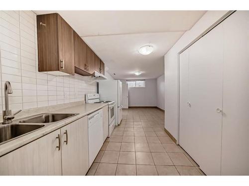 252 And 254 Midridge Place Se, Calgary, AB - Indoor Photo Showing Kitchen With Double Sink