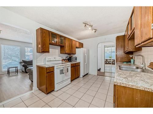 252 And 254 Midridge Place Se, Calgary, AB - Indoor Photo Showing Kitchen With Double Sink