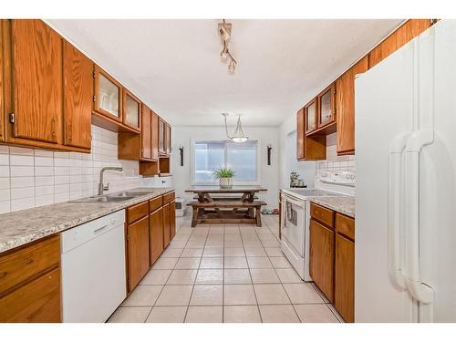 252 And 254 Midridge Place Se, Calgary, AB - Indoor Photo Showing Kitchen With Double Sink