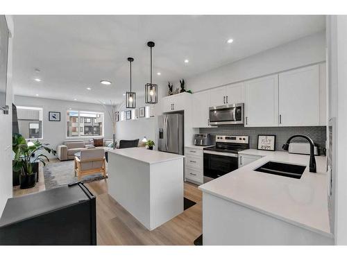 302 Corner Glen Circle Ne, Calgary, AB - Indoor Photo Showing Kitchen With Stainless Steel Kitchen With Double Sink With Upgraded Kitchen