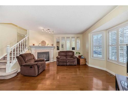 19 Mt Mckenzie Way Se, Calgary, AB - Indoor Photo Showing Living Room With Fireplace