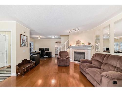 19 Mt Mckenzie Way Se, Calgary, AB - Indoor Photo Showing Living Room With Fireplace