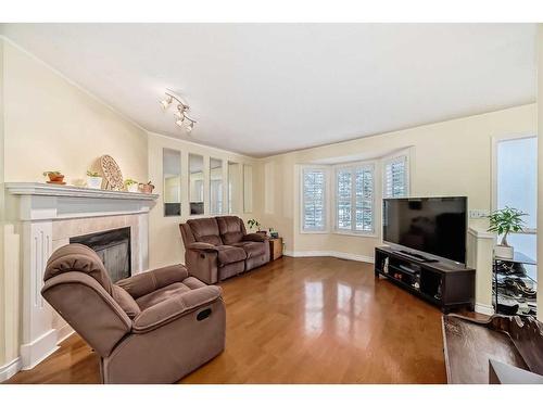 19 Mt Mckenzie Way Se, Calgary, AB - Indoor Photo Showing Living Room With Fireplace