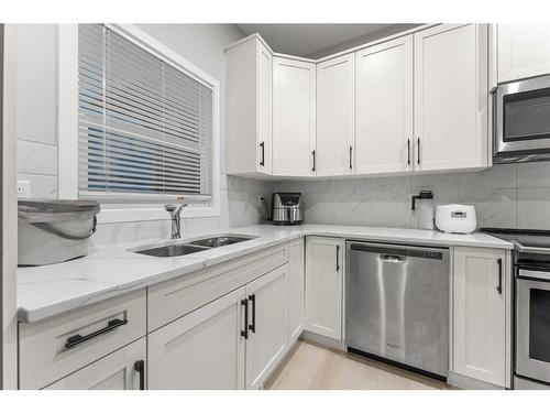 34 Cornerbrook Manor Ne, Calgary, AB - Indoor Photo Showing Kitchen With Stainless Steel Kitchen With Double Sink