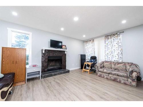 55 Templemont Drive Ne, Calgary, AB - Indoor Photo Showing Living Room With Fireplace