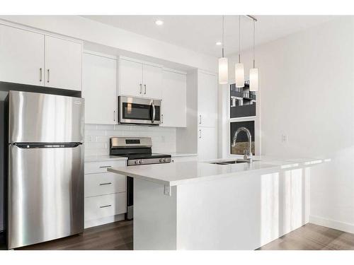 4-2117 81 Street Sw, Calgary, AB - Indoor Photo Showing Kitchen With Stainless Steel Kitchen With Upgraded Kitchen