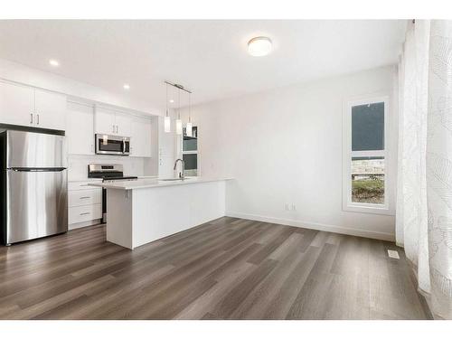 4-2117 81 Street Sw, Calgary, AB - Indoor Photo Showing Kitchen With Stainless Steel Kitchen With Upgraded Kitchen