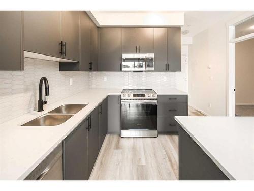 6307-15 Sage Meadows Landing Nw, Calgary, AB - Indoor Photo Showing Kitchen With Stainless Steel Kitchen With Double Sink With Upgraded Kitchen