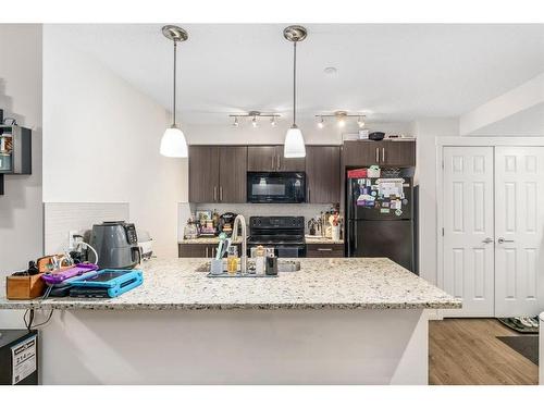 4101-755 Copperpond Boulevard Se, Calgary, AB - Indoor Photo Showing Kitchen With Upgraded Kitchen