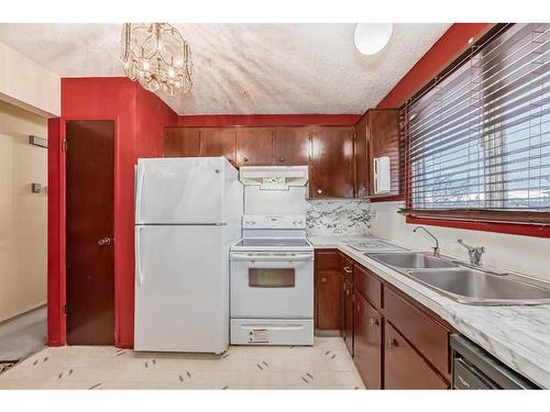 255 Rundleridge Drive Ne, Calgary, AB - Indoor Photo Showing Kitchen With Double Sink